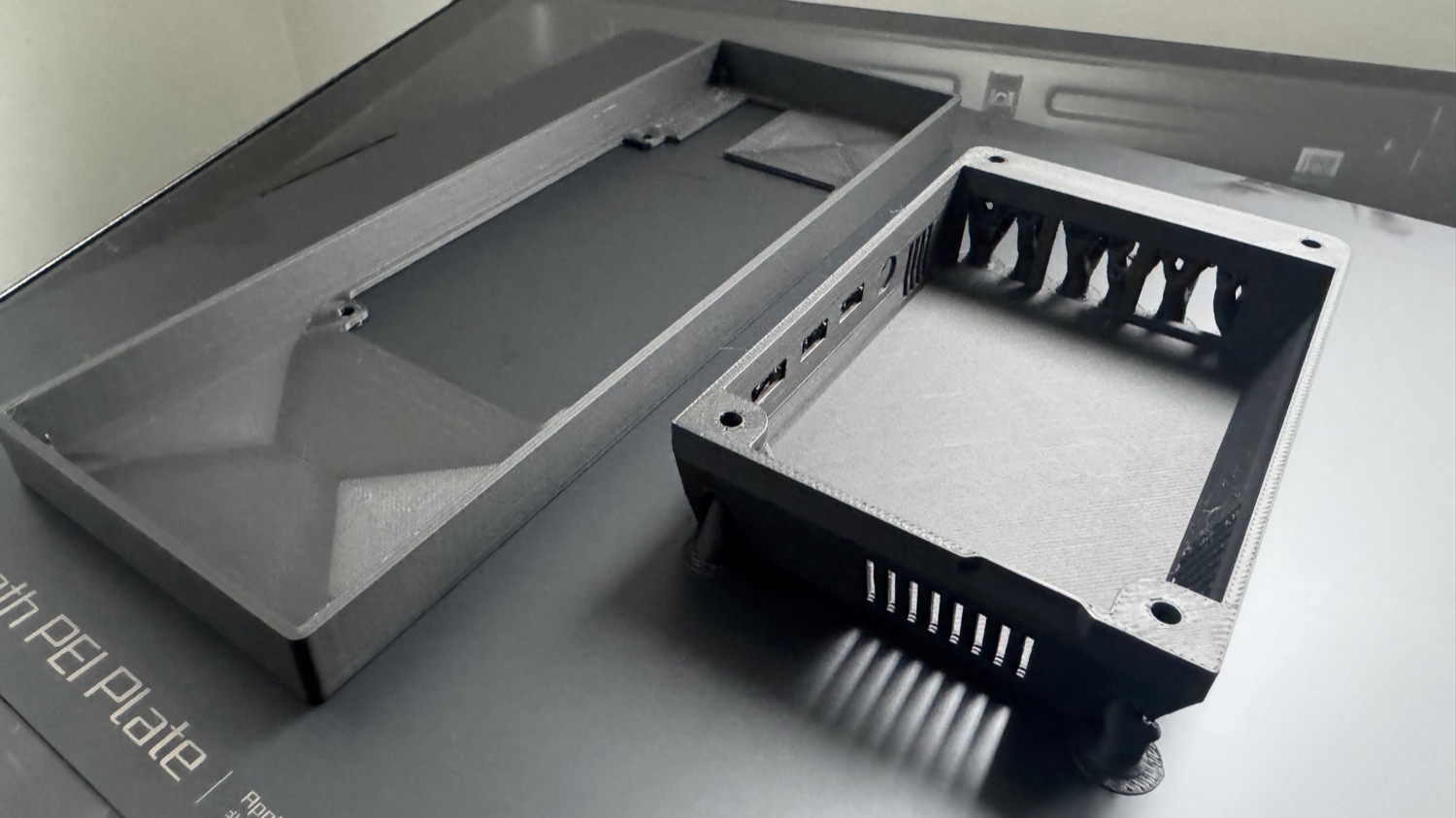 3D-printed case parts fresh off the printer